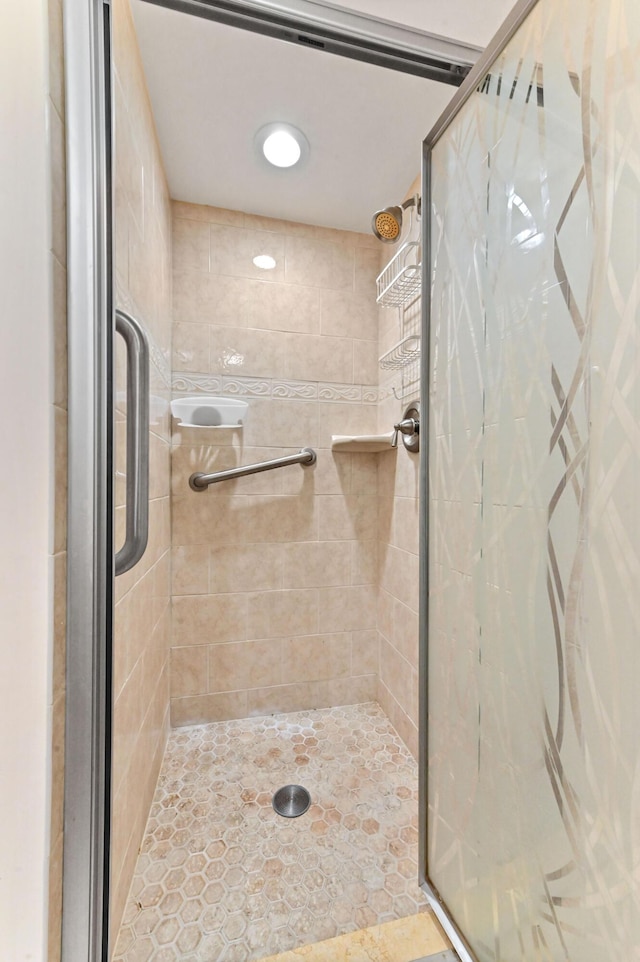 full bath with a shower stall