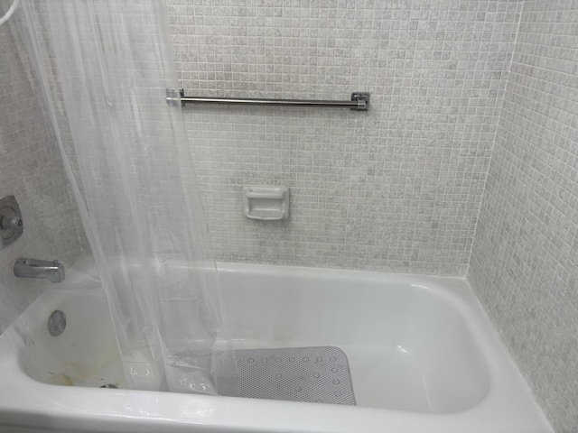 full bathroom with shower / bath combo