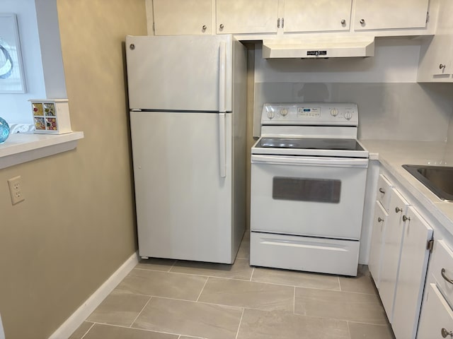 kitchen with light countertops, white appliances, white cabinetry, and under cabinet range hood