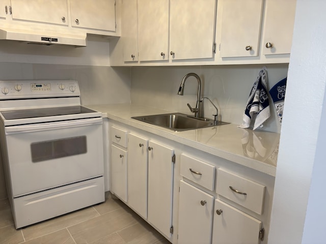 kitchen featuring under cabinet range hood, white electric range, a sink, white cabinetry, and light countertops