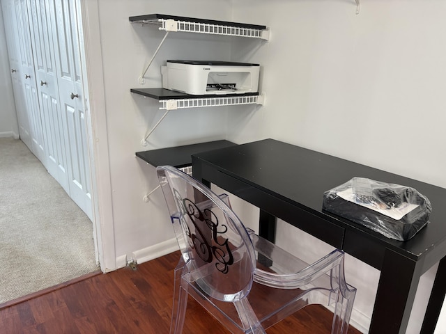 details featuring baseboards and wood finished floors