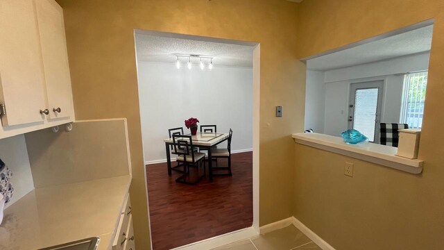 living area featuring baseboards and wood finished floors