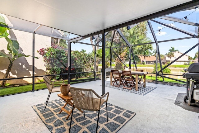 view of patio with glass enclosure