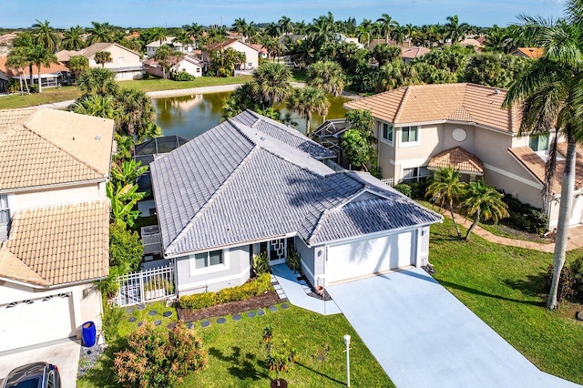 drone / aerial view featuring a residential view and a water view