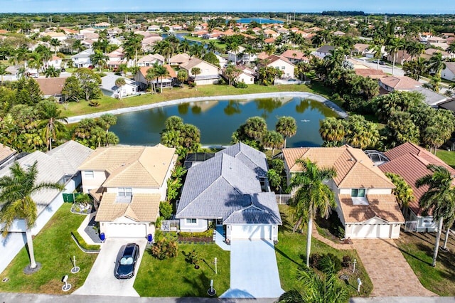 aerial view featuring a residential view and a water view