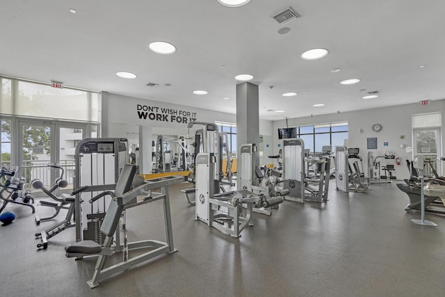 exercise room with french doors and visible vents