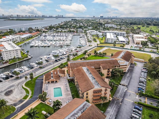 drone / aerial view featuring a view of city and a water view