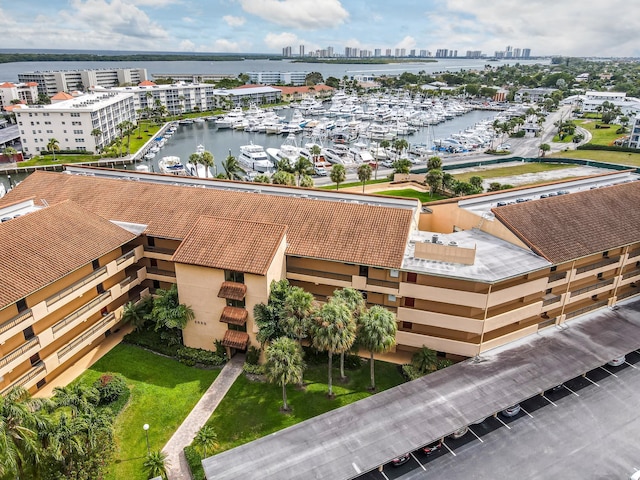 bird's eye view featuring a view of city and a water view