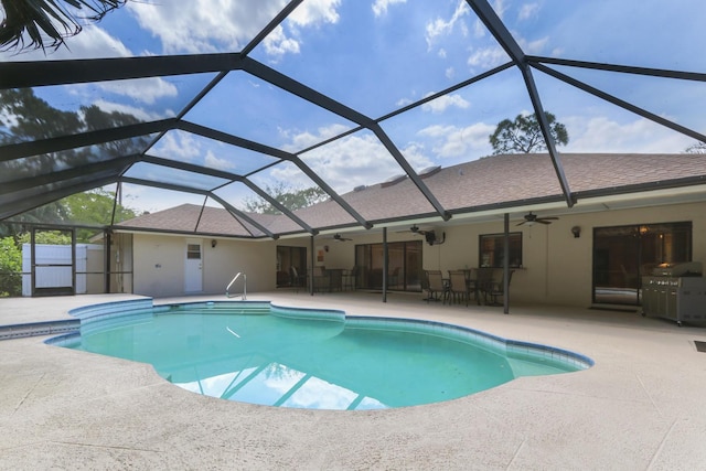 outdoor pool with a patio area, outdoor dining space, glass enclosure, and ceiling fan