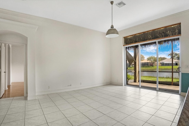 unfurnished room featuring a water view, light tile patterned floors, visible vents, and ornamental molding