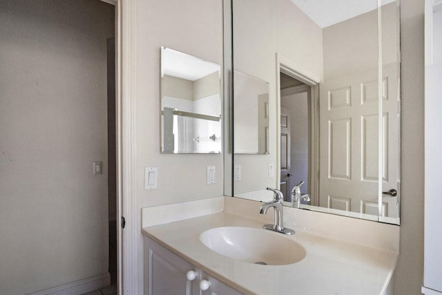 bathroom featuring vanity and baseboards