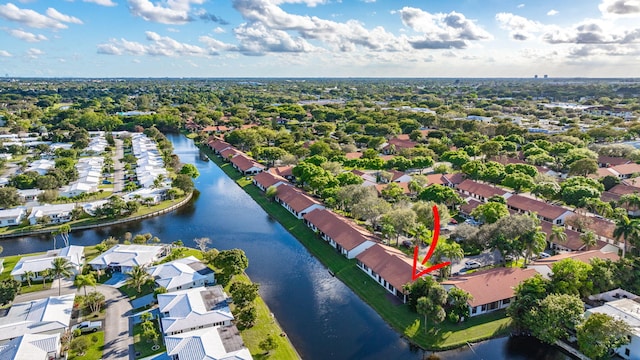 birds eye view of property featuring a water view and a residential view