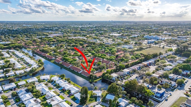 bird's eye view featuring a water view and a residential view