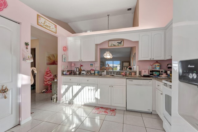 kitchen with vaulted ceiling, white appliances, a sink, and white cabinetry