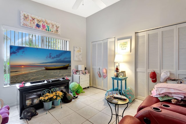 interior space featuring light tile patterned flooring and ceiling fan