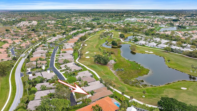 birds eye view of property featuring golf course view, a water view, and a residential view