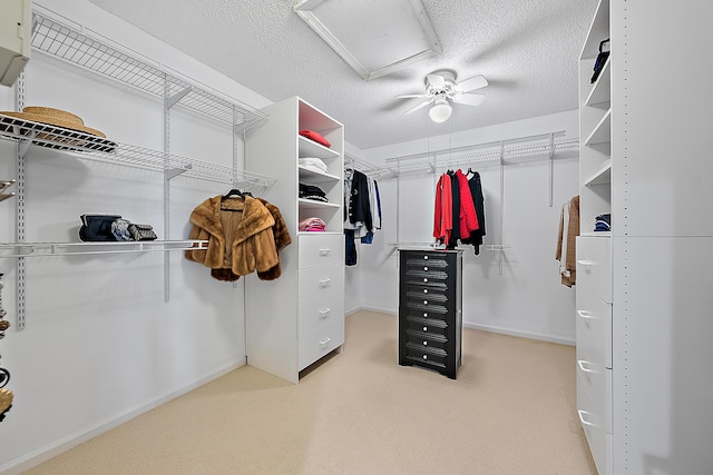 walk in closet featuring ceiling fan