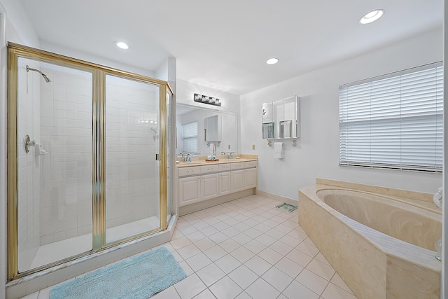 bathroom with double vanity, a sink, a shower stall, a bath, and tile patterned floors