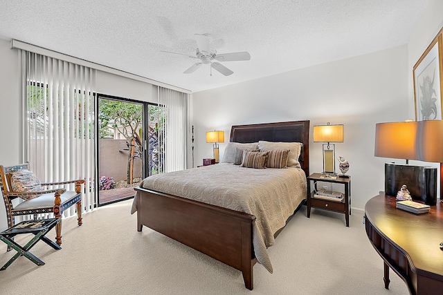 bedroom with light carpet, ceiling fan, a textured ceiling, and access to exterior