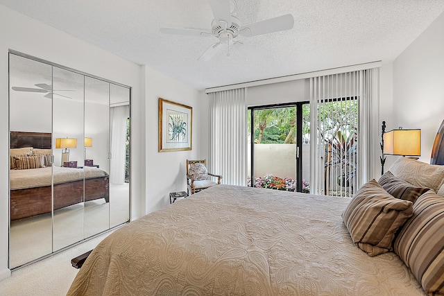 bedroom featuring a textured ceiling, carpet floors, a ceiling fan, access to outside, and a closet