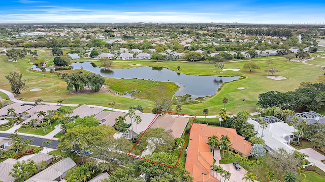 aerial view with a water view, a residential view, and golf course view