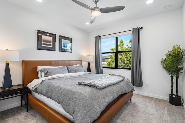 bedroom featuring light carpet, recessed lighting, a ceiling fan, and baseboards