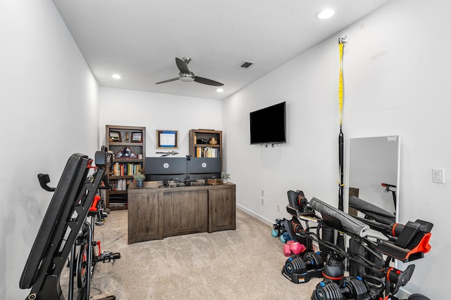 interior space with light carpet, visible vents, ceiling fan, a textured ceiling, and recessed lighting