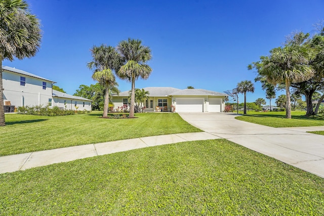 ranch-style house with a garage, a front yard, and driveway