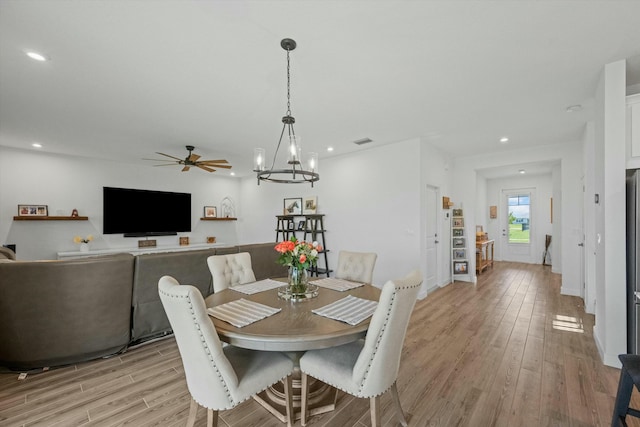 dining space featuring light wood-style floors, recessed lighting, visible vents, and ceiling fan