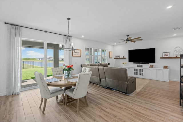 dining room with light wood-style flooring, visible vents, and recessed lighting