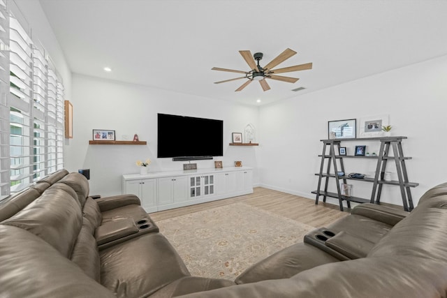 living room featuring a ceiling fan, visible vents, wood finished floors, and recessed lighting