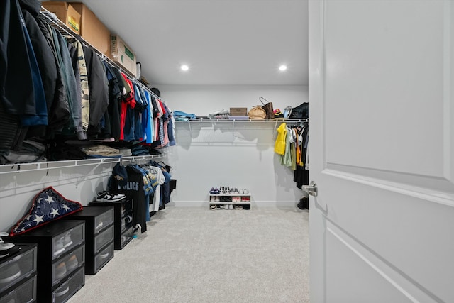 spacious closet featuring carpet flooring