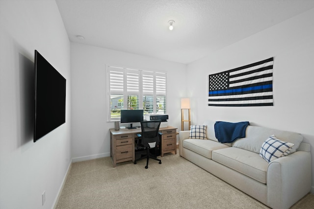 office featuring light carpet and baseboards