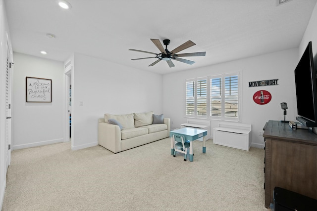 carpeted living area with ceiling fan, recessed lighting, and baseboards