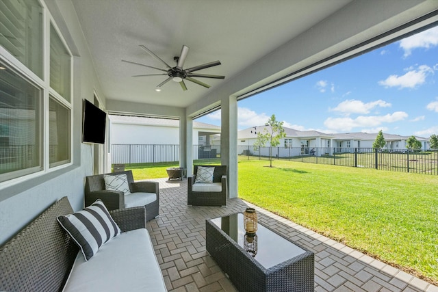 view of patio / terrace with a residential view, a fenced backyard, ceiling fan, and an outdoor living space