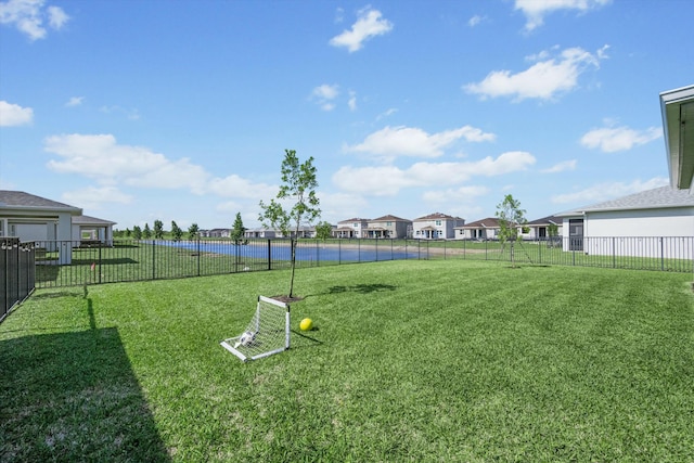 view of yard with a residential view and fence