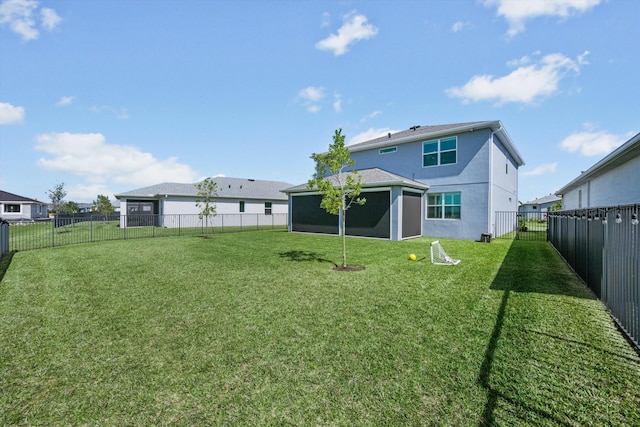 back of property featuring a fenced backyard, a yard, and stucco siding