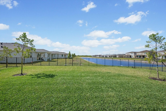 view of yard with a residential view and fence