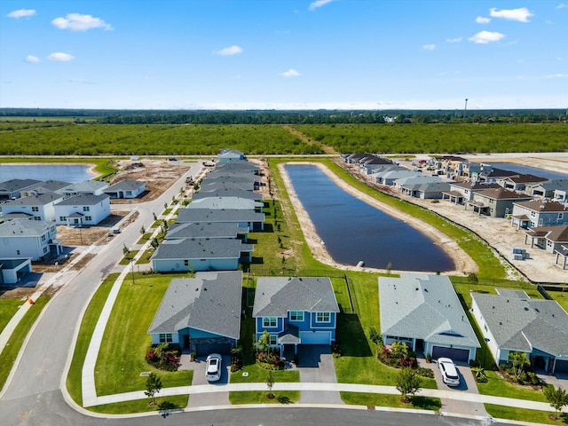 aerial view featuring a water view and a residential view