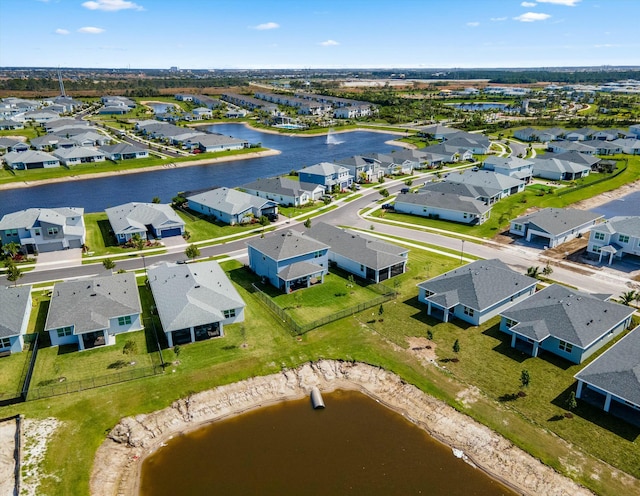 bird's eye view with a water view and a residential view