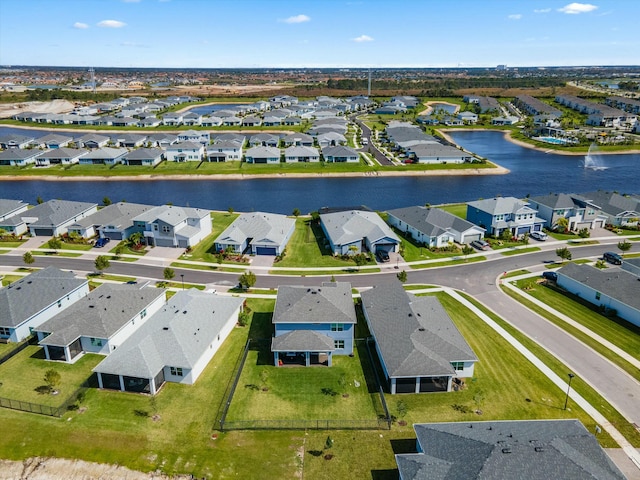 aerial view featuring a water view and a residential view