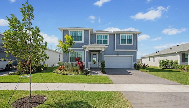 view of front of property with a garage, stucco siding, decorative driveway, and a front yard