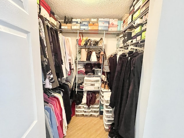 spacious closet with wood finished floors