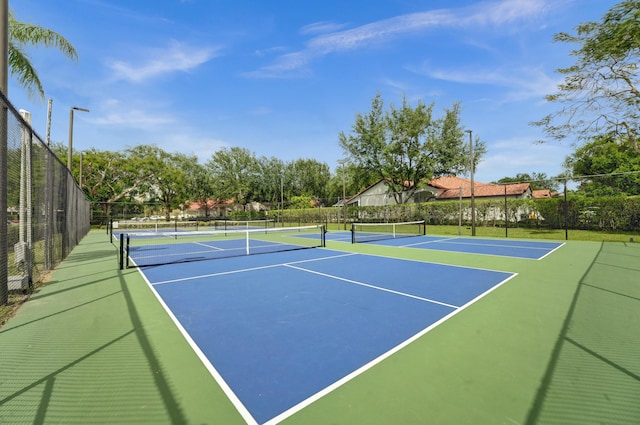 view of sport court with community basketball court and fence