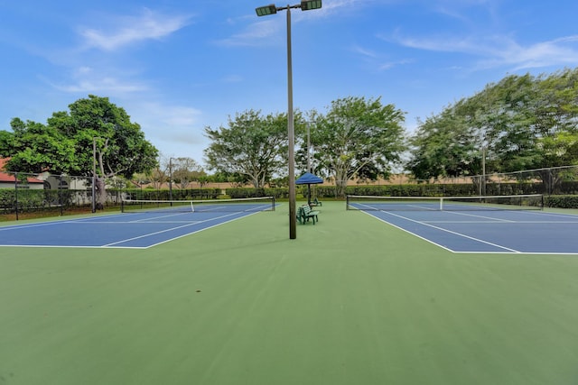 view of sport court featuring community basketball court and fence