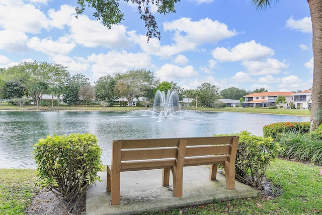 surrounding community with a water view