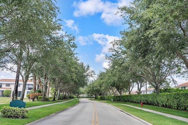 view of road featuring sidewalks and curbs