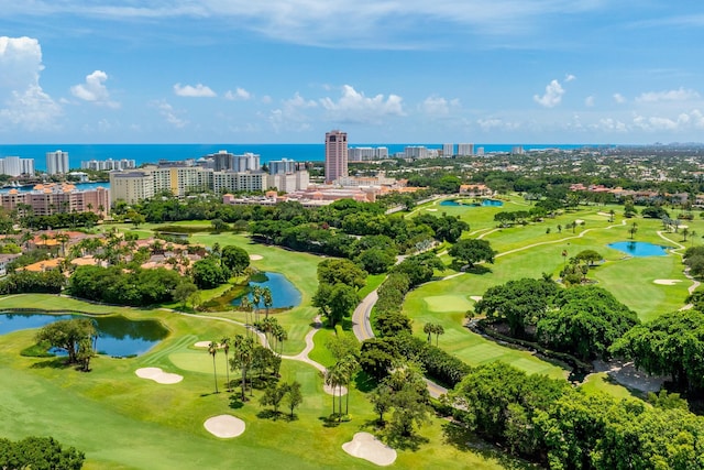 birds eye view of property with a view of city, golf course view, and a water view