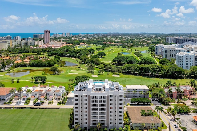 birds eye view of property featuring a view of city, a water view, and golf course view