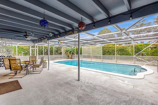 view of pool with a lanai, a patio area, ceiling fan, and a fenced in pool